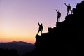 Celebrating climbers on mountain peak