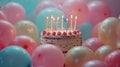 Celebrating with Colorful Balloons and a Birthday Cake with Candles Royalty Free Stock Photo