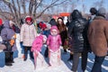 Celebrating the end of winter, children playing games