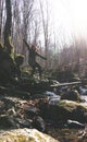 Celebrating Freedom happy woman feeling alive and free arms raised up to sky,positive girl in a river in the forest Royalty Free Stock Photo