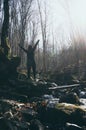 Celebrating Freedom happy woman feeling alive and free arms raised up to sky,positive girl in a river in the forest Royalty Free Stock Photo