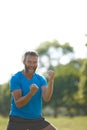 Celebrating life. a mature man looking very excited while celebrating a victory outside. Royalty Free Stock Photo