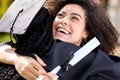 Celebrating memories of the past and dreams of the future. a young woman hugging her friend on graduation day. Royalty Free Stock Photo