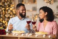Happy black woman and man drinking wine on a date Royalty Free Stock Photo