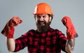 Celebrating success. man in gloves. construction worker in hard hat. engineer architect working in safety helmet. brutal Royalty Free Stock Photo