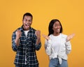 Celebrating success. Portrait of cheerful happy young african american people husband and wife in basic clothes Royalty Free Stock Photo