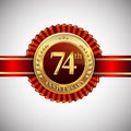 Celebrating 74th anniversary logo, with golden badge and red ribbon isolated on white background