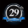 Celebrating 29th anniversary logo. with silver ring and blue ribbon