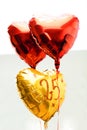 Celebrating 25th years anniversary golden label with ribbon and balloons,