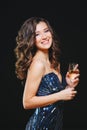 Celebrating Woman. Holiday People. Beautiful Girl with perfect Makeup Holding Glass of Champagne