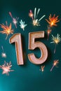 Celebrating 15 Years of Excellence Shining Numbers and Sparkles on Deep Emerald Green Background Royalty Free Stock Photo