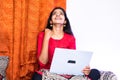 Celebrating young teenger girl while using laptop at home - concept of got job or exam results, won lottery and