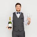 Man with bottle of champagne and glasses at party Royalty Free Stock Photo