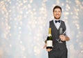 Man with bottle of champagne and glasses at party Royalty Free Stock Photo