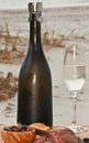 Celebration of autumn with a chilled glass and a vintage bottle of champagne Royalty Free Stock Photo