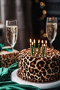 celebration birthday cake with leopard spots, with birthday candles