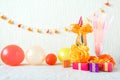 Celebration, Birthday party background with colorful party hat, confetti, gift boxes and other decor Royalty Free Stock Photo