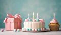 Celebration Cupcakes: Colorful cupcakes with lit candles displayed against a backdrop of wrapped gifts. Captured indoors Royalty Free Stock Photo