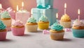 Celebration Cupcakes: Colorful cupcakes with lit candles displayed against a backdrop of wrapped gifts. Captured indoors Royalty Free Stock Photo