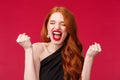 Celebration, emotions and beauty concept. Close-up portrait of pretty young elegant redhead woman feel like champion Royalty Free Stock Photo