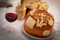 A homemade Slava cake decorated with religious symbol