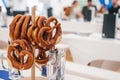 Celebration of the famous German beer festival Oktoberfest. Traditional pretzels called Brezel hang on the stand on the