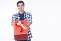 Celebration festive Christmas, new year, birthday and valentine concept. Positive handsome cool young man holding red gift box Royalty Free Stock Photo