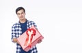 Celebration festive Christmas, new year, birthday and valentine concept. Positive handsome cool young man holding red gift box Royalty Free Stock Photo