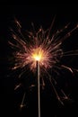 Celebration festive sparkler sparks in the dark and lights up the new years night Royalty Free Stock Photo