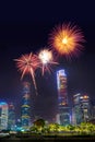 Celebration firework in twilight night cityscape of guangzhou urban skyscrapers at storm with lightning  bolts in night purple Royalty Free Stock Photo