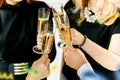 Celebration. Hands holding the glasses of champagne and wine making a toast. Royalty Free Stock Photo