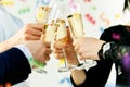 Celebration. Hands holding the glasses of champagne and wine making a toast. Royalty Free Stock Photo