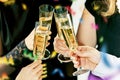 Celebration. Hands holding the glasses of champagne and wine making a toast. Royalty Free Stock Photo