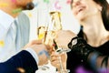 Celebration. Hands holding the glasses of champagne and wine making a toast. Royalty Free Stock Photo