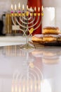 The celebration of Hanukkah Judaism tradition holiday symbols by lighting hanukkiah candles on the menorah Royalty Free Stock Photo