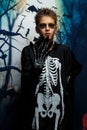 Celebration of holiday Halloween, the cute 8 year boy  in the image, costume, the skeleton theme, the vampire, bat concept Royalty Free Stock Photo