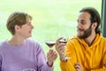 celebration, holidays and people concept - happy biracial couple drinking red wine at restaurant Royalty Free Stock Photo