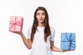 Celebration, holidays and presents concept. Waist-up portrait of cute, dreamy young girl wondering what gift box is