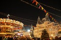 Celebration lights and decorations on Red Square for festive Christmas and New Year. Shining yellow lights on facade GUM in Moscow Royalty Free Stock Photo