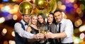 Happy friends clinking champagne glasses at party Royalty Free Stock Photo