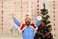 Santa Claus with happy and successful face near Christmas tree Royalty Free Stock Photo