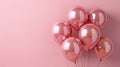 Celebration in Pastel: Rose Gold Foil Balloons on Pink Background for Party, Birthday, Wedding, Anniversary or Special Occasion Royalty Free Stock Photo