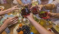 Celebration. People holding glasses of white wine making a toast. Royalty Free Stock Photo