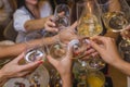 Celebration. People holding glasses of white wine making a toast. Royalty Free Stock Photo