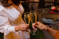 Celebration. People holding glasses of white wine making a toast. Royalty Free Stock Photo