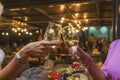 Celebration. People holding glasses of white wine making a toast. Royalty Free Stock Photo