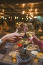 Celebration. People holding glasses of white wine making a toast. Royalty Free Stock Photo