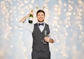 Man with bottle of champagne at christmas party Royalty Free Stock Photo