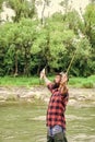 celebrationg success. summer weekend. Happy fly fishing. mature man fly fishing. man catching fish. fisherman show Royalty Free Stock Photo