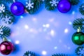 Celebratory background with Christmas decorations and multicolored backligt. Space for text.